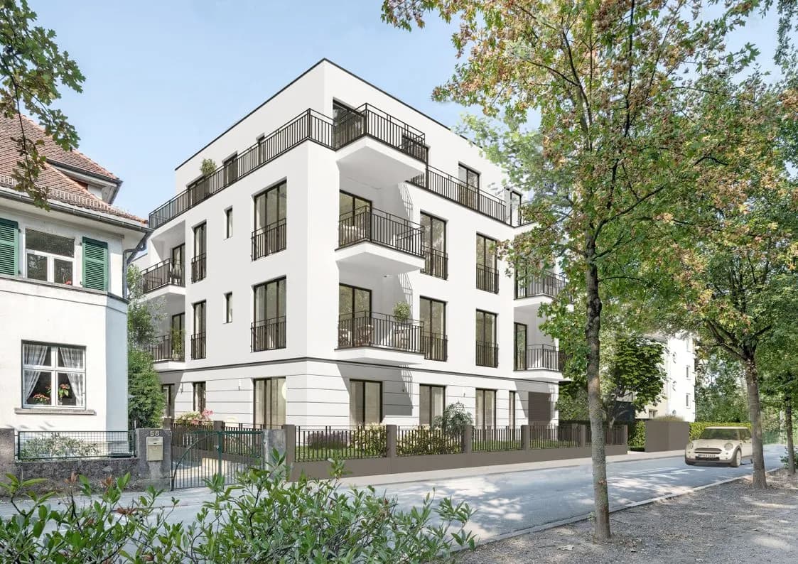 WestendParkSuites in Offenbach, weißes Mehrfamilienhaus mit Balkonen an einer Allee